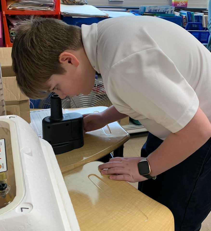 Student with microscope